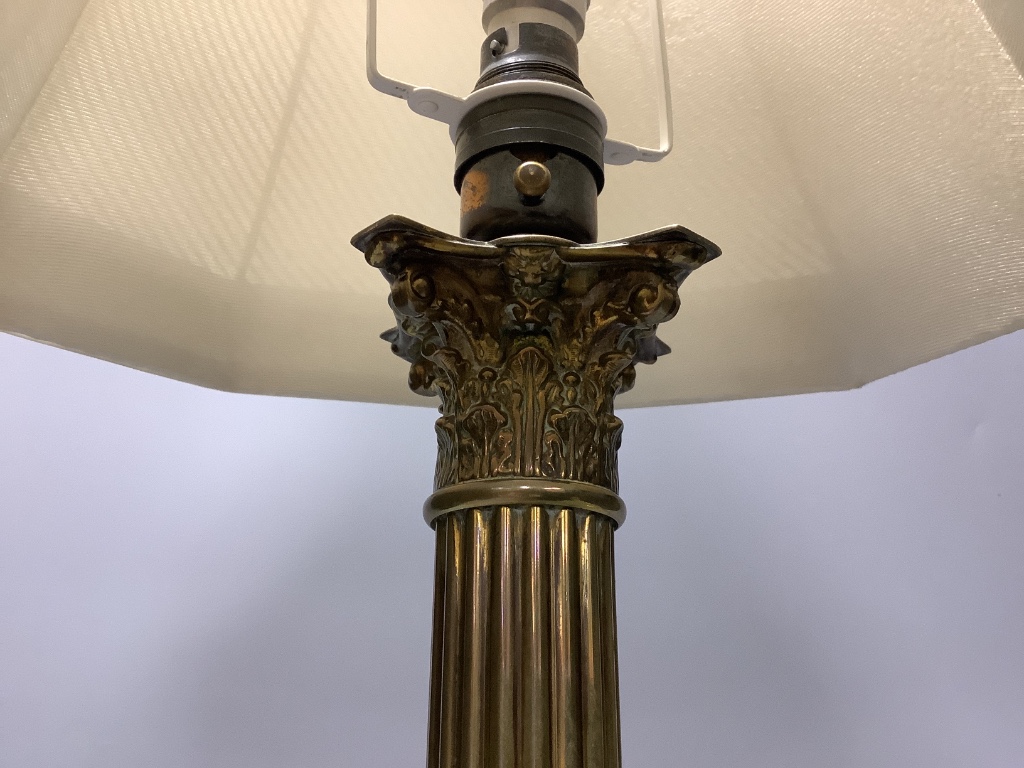 A brass corinthian table lamp and an Edwardian inlaid mahogany letter rack